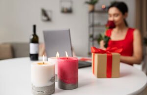 How to Store Soy Candles to Preserve Fragrance and Appearance Lit soy candles with gift box and woman holding rose in background